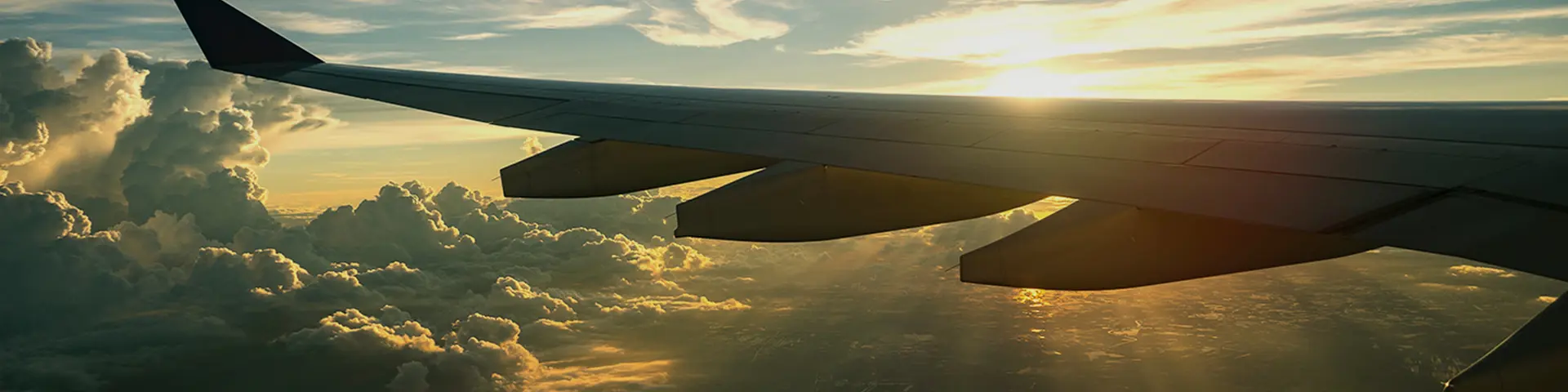 airplane-wing-sunset-clouds-view