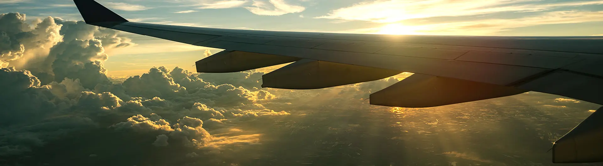 airplane-wing-sunset-clouds-view