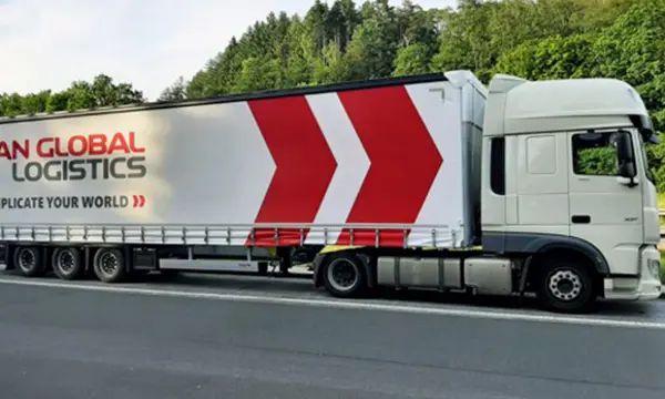 scan-global-logistics-truck-forest-road